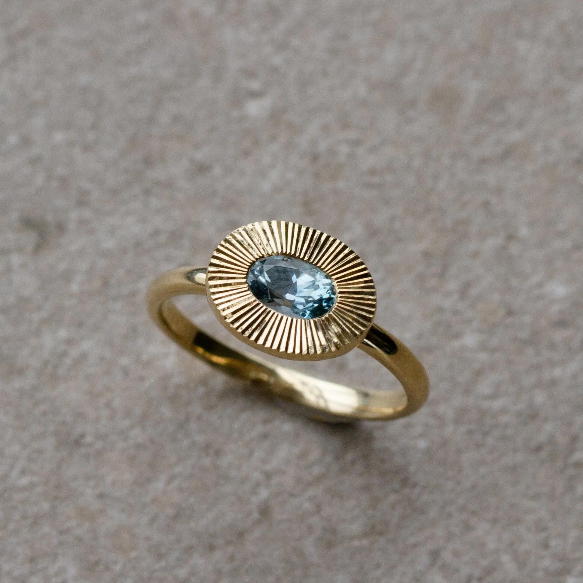 East-West Aurora Solitaire with Teal Oval Montana Sapphire