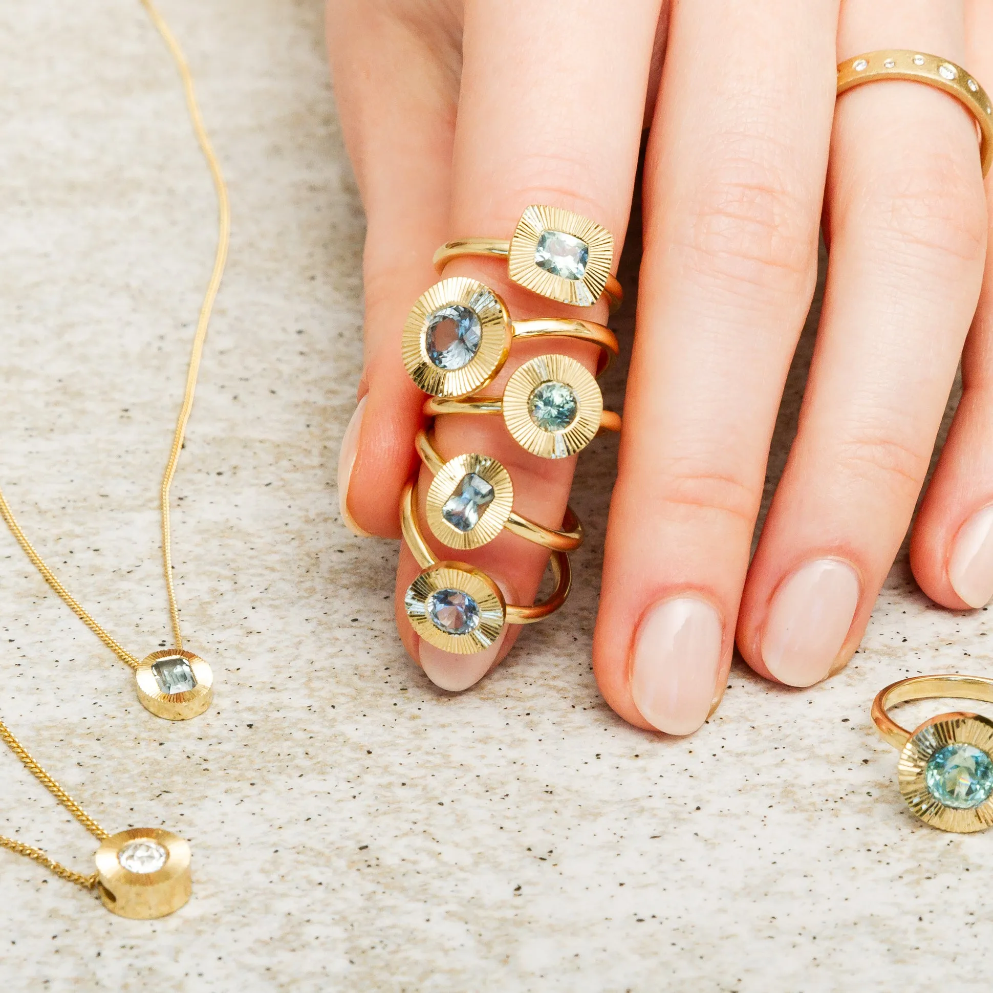 East-West Aurora Solitaire with Teal Oval Montana Sapphire